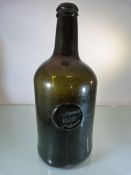 Large Green Glass antique 'Breast Bottle' with applied stamp to front 'Prytherech 1819.Height approx