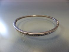 Silver bangle inset with brilliant cut CZs