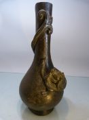 Japanese bronze bottle vase with applied dragon decoration. The tail of the dragon circling the