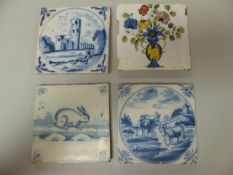 Four Delftware tiles - 1) Decorated in Polychrome colours depicting a vase of flowers. 2) An Early