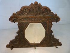 Antique Arts and Crafts hall mirror with cast metal hooks