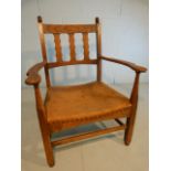 Small oak armchair with hide seat by Davis & Son.