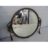 Bronze patinated wall mirror in the manner of Edgar Brandt with scroll work sides.