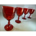 Set of Four heavy cranberry glass facet stemmed wine glasses along with a clear glass antique