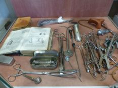 Selection of various Medical Equipment along with two books.