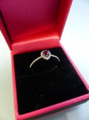 18CT white gold ruby and diamond cluster ring
