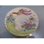 Chinese hand painted porcelain saucer/dish depicting a phoenix and flowers. Characters to reverse