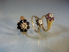 Three ladies 9ct gold rings in the Daisy Cluster style