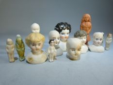 Collection of Tea Cosy porcelain dolls along with some miniature porcelain dolls