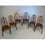 Set of six Elm and Beech Glenister dining chairs with stick backs. (Two include two carvers)