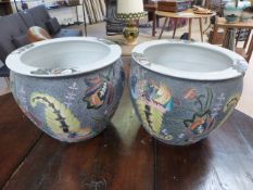 Pair of Oriental fishbowls decorated with Lotus on a blue ground.