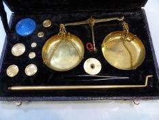 Set of boxed brass jewellery scales and weights