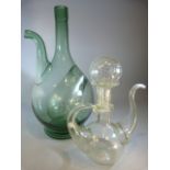 Green glass wine decanter with ice recess along with a clear 'bubble' glass oil pourer with stopper