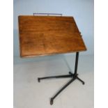 Edwardian Adapta reading table on cast iron base with oak tray.