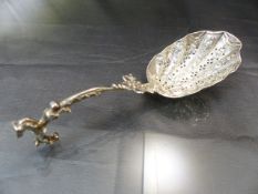 Dutch hallmarked silver sifter Stamped with lion to back and 2 under. The unusual spoon with rearing