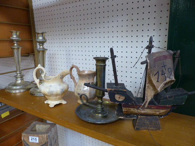 Wooden miniature of a ship on plinth, pair of silverplated candlesticks and one other and two
