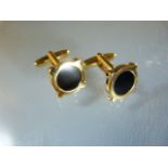 Pair of Gold plated cuff links with central black panel.