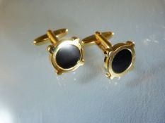 Pair of Gold plated cuff links with central black panel.