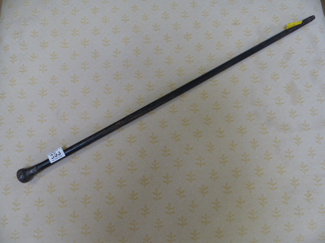 Hallmarked silver topped cane, London. The Silver top having trailing floral detailing on an
