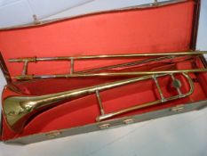 Gold Coloured Besson Trombone in carry case.