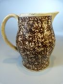 Staffordshire Creamware sparrow beak milk jug of Tortoise shell ware design. Loop handle.