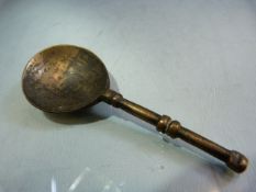 Early Bronze spoon with large bowl and simplistic banded handle.