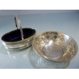 Hallmarked silver salt with blue glass liner London 1819 maker Hyam Hyams. Along with a small