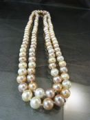 Approx 110cm length necklace of pearls in shades of pinks