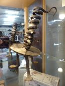 Late 16th Century/Early 17th Century iron candle holder of twisted form. With iron skirt on flat pad
