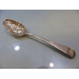 Late Georgian silver berry spoon, with repousse bowl depicting fruit and foliage with engraved