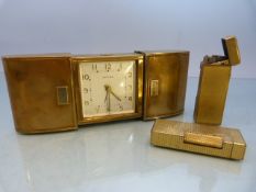 Vintage brass Estyma Jewels travel clock in retractable case and two Dunhill lighters