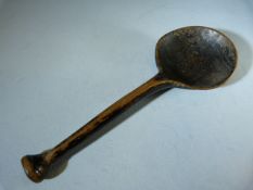 Antique carved wooden spoon poss (Cawl spoon) with large rounded bowl. Black lacquered paint