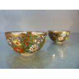 Two miniature 20th century Sake cups adorned with floral detailing