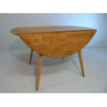 Blonde Ercol drop leaf dining table on stick legs