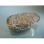 Silver coin holder with embossed decoration dated Birmingham 1907 (makers mark rubbed "S.L"?)