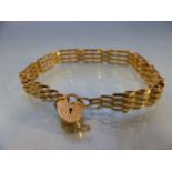 9ct Gold four bar bracelet with heart shaped clasp (total weight approx 6.8g)