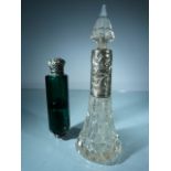 A pair of scent bottles. Goldsmiths Company and Emporium engraved to the base of the clear glass and