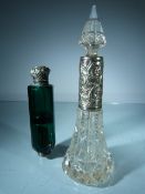 A pair of scent bottles. Goldsmiths Company and Emporium engraved to the base of the clear glass and