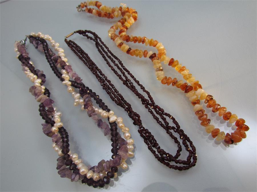 Three bead necklaces - 1) Garnet faceted 3 string with a rolled gold barrel clasp. 2) Twisted Rope