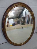 Oval mirror in Chinoiserie decorated frame.