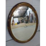 Oval mirror in Chinoiserie decorated frame.