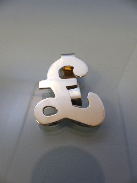 Silver money clip in the form of a pound sign