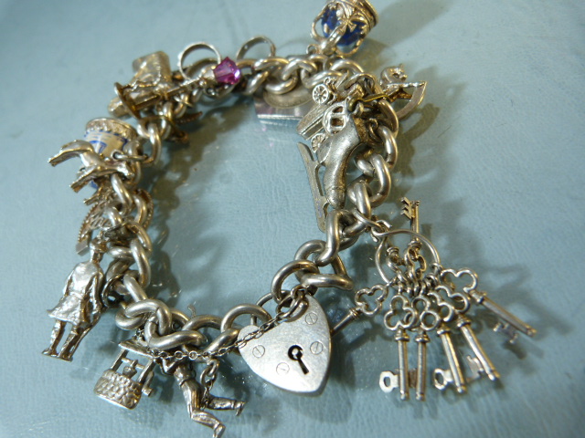 Two hallmarked silver chains with approx 35 silver coloured charms along with a silver box chain and - Image 4 of 6