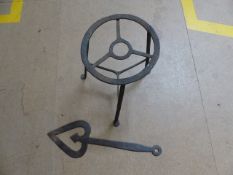 17th Century iron trivet on flat pad feet and an iron fire stoke.