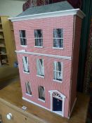 Red Brick Dolls house in the style of a Victorian Town house with large collection of accessories