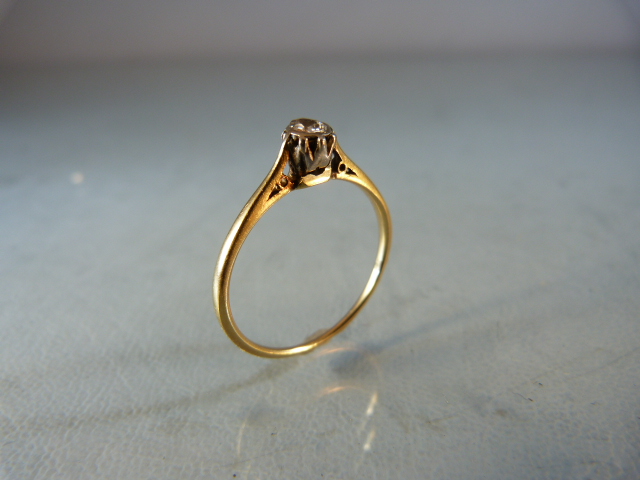 Single solitaire diamond ring on gold band (hallmarks rubbed) size P