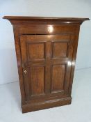 19th Century oak cupboard of small size with bracket feet and ivory escutcheon
