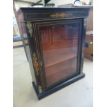 Victorian ebonised music cabinet with glazed door. Gilded supports and decoration