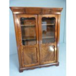 Flame mahogany display cabinet with shaped frames to glass windows