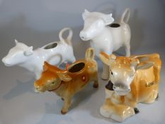 Four Jersey cow creamers - 2 blanc de chine, swiss and a Guernsey example.